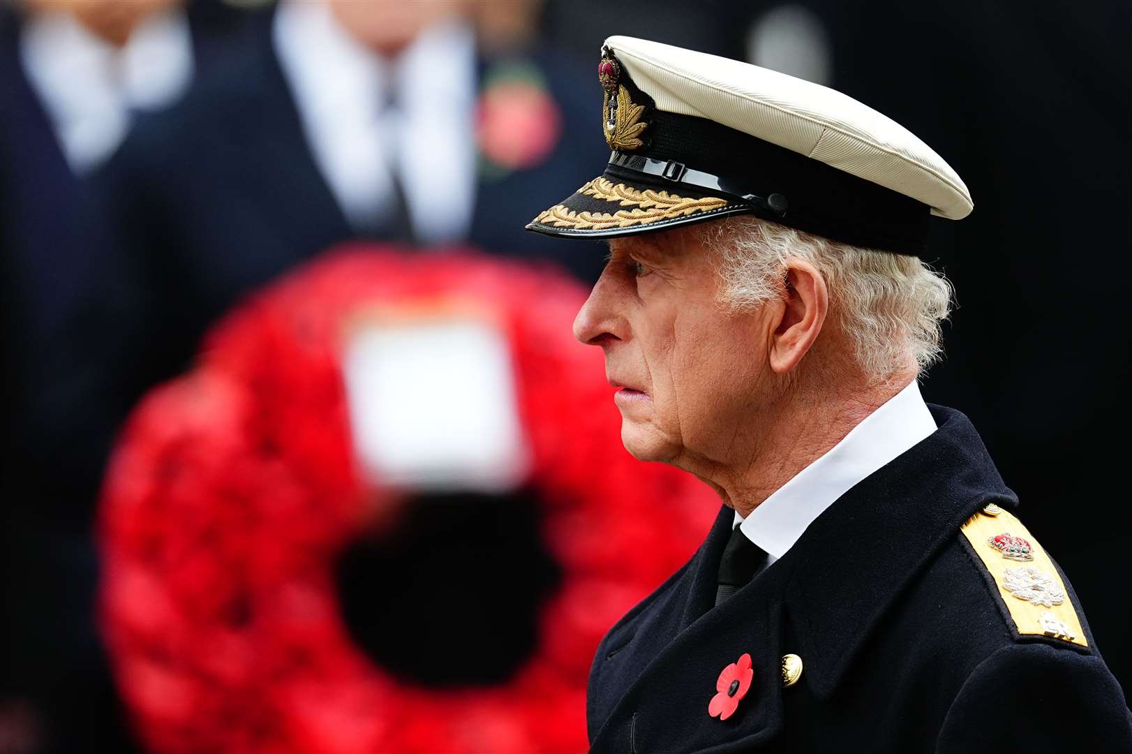 The King stands in silence during the Remembrance Sunday service at the Cenotaph in London (Aaron Chown/PA)