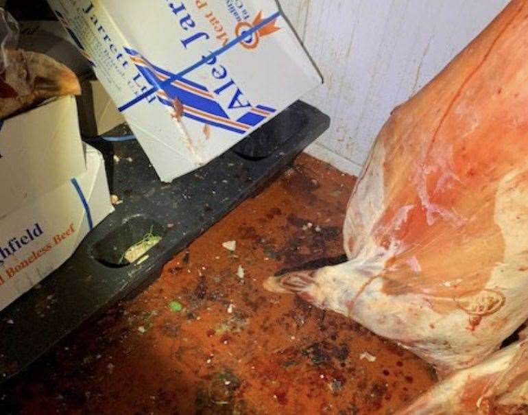 Meat is pictured touching the floor at the shop