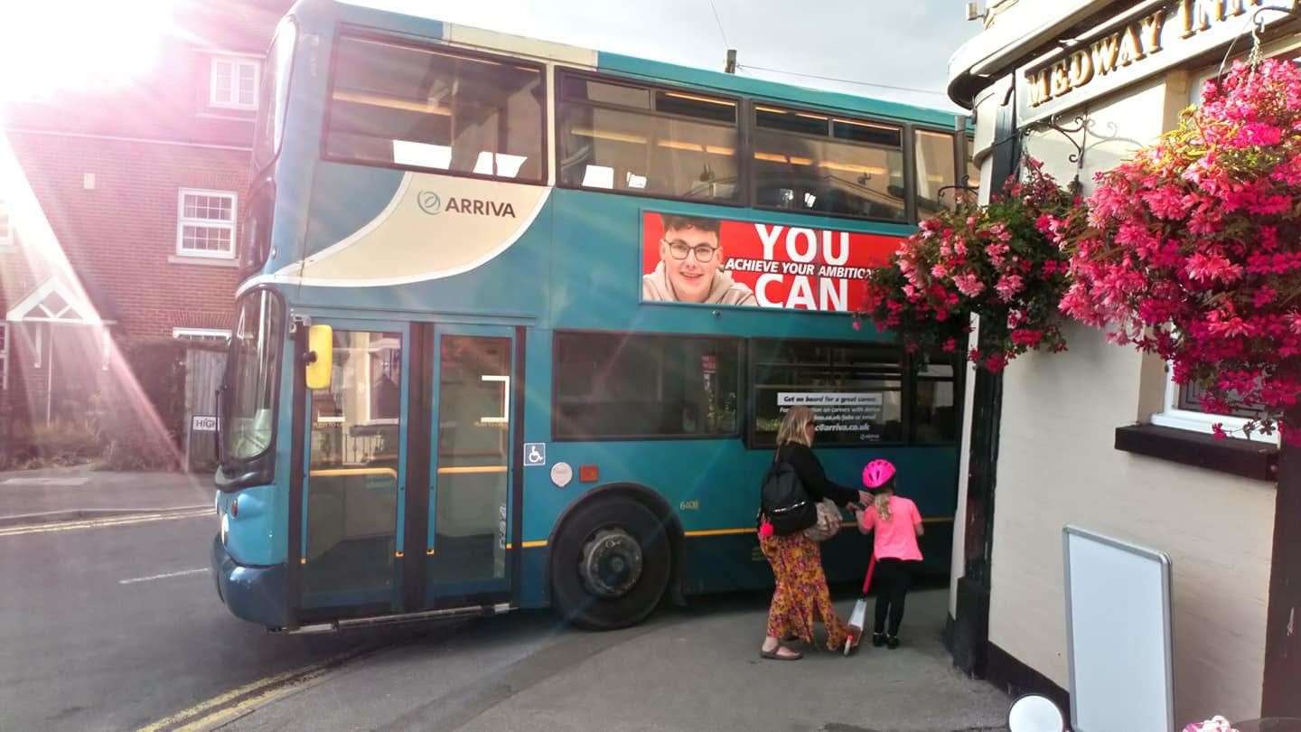 A bus mounts the pavement in Wouldham