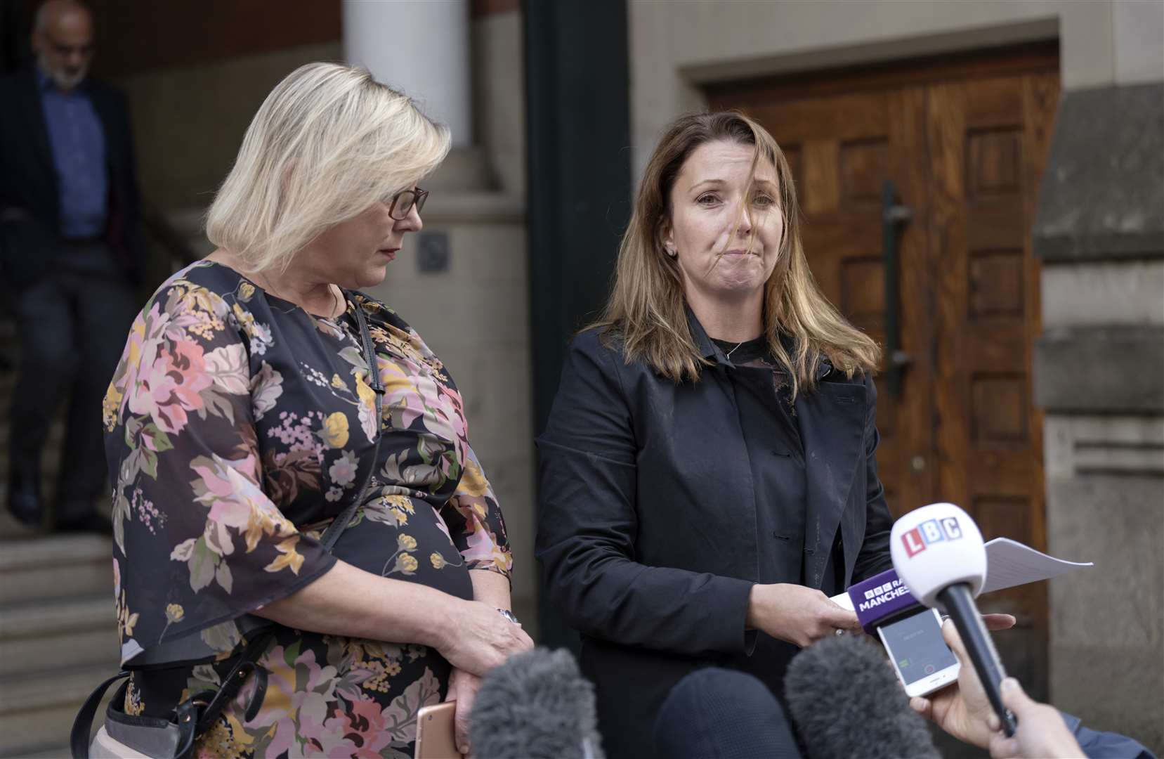 Solicitors Rose Gibson, left, and Polly Herbert (right), read a statement outside Minshull Street Crown Court after Adil Iqbal was jailed for 12 years (Danny Lawson/PA)