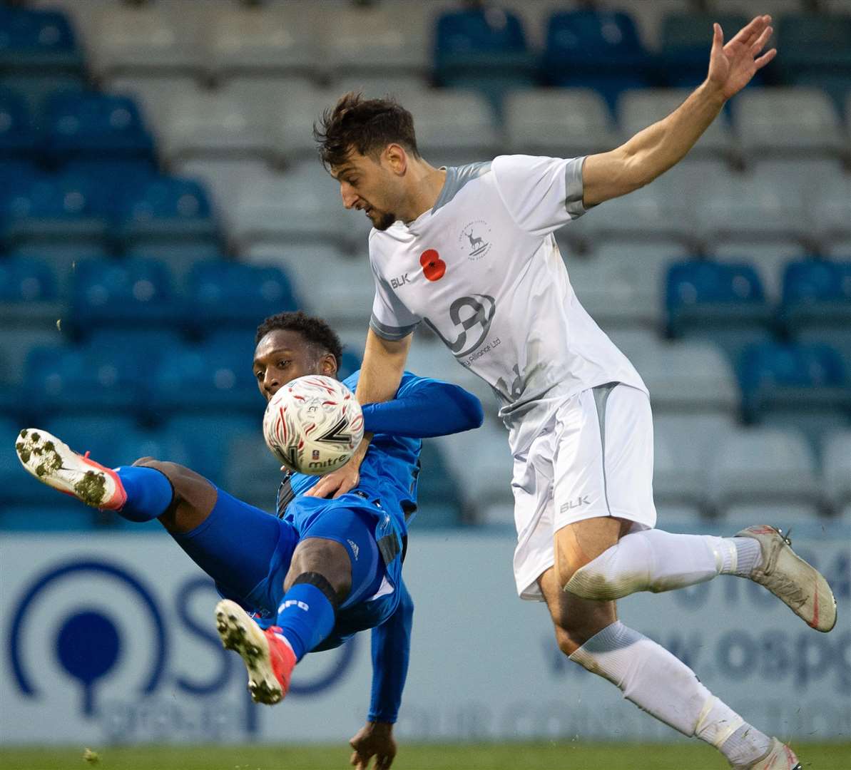 Brandon Hanlan takes a tumble under a challenge from Myles Anderson Picture: Ady Kerry