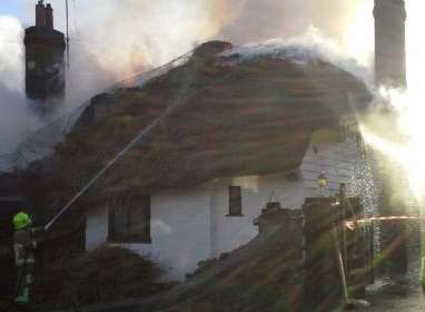 The smouldering cottage in Chevening. Picture: @SECAmbHART