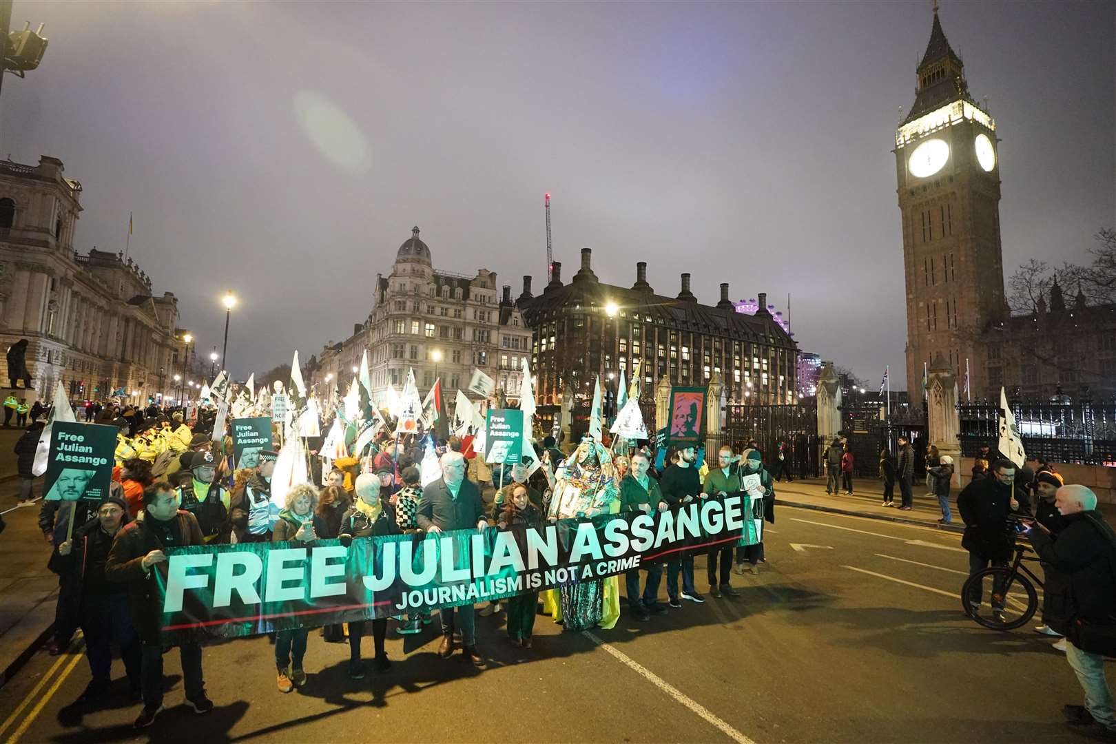 Campaigners pressing for the release of Assange take part in a demonstration during a Night Carnival in Parliament Square (PA)