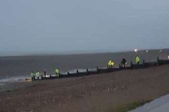 Police combing the beach. Picture: Mark Bollen