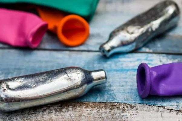 Cans of nitrous oxide, also known as laughing gas. Image: Stock photo.