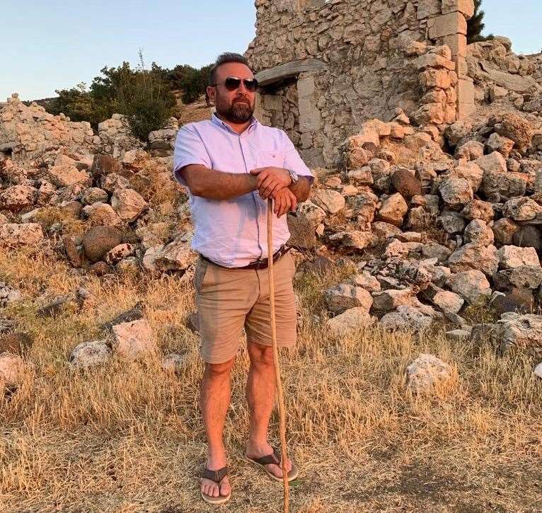 Herne Bay restaurateur Mehmet Dari next to what was his childhood home