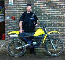 Sgt Nigel Douglas with the seized bike