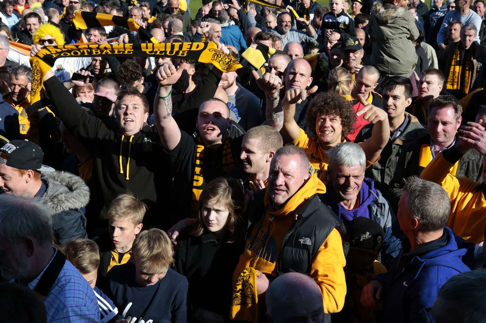 Maidstone fans celebrate on the pitch after all-but sealing the Ryman Premier title at Dulwich four years ago Picture: Martin Apps