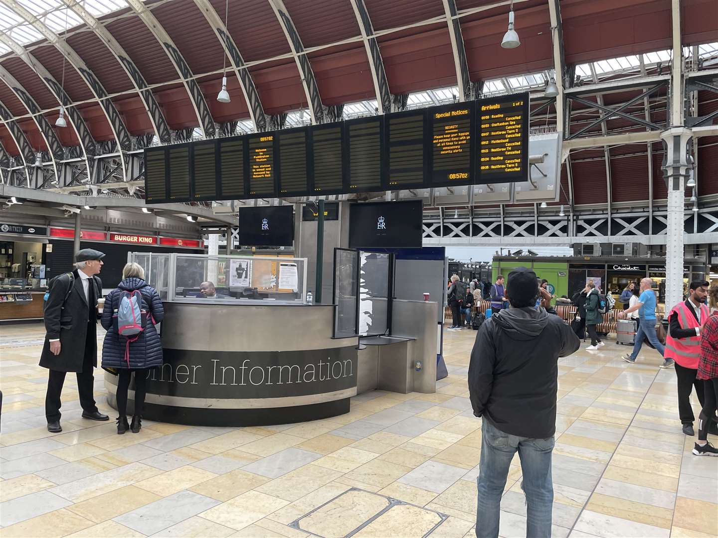 Members of the public looking at the travel boards in Paddington Station as journeys were disrupted for mourners attempting to travel to the Queen’s funeral (Margaret Davis/PA)