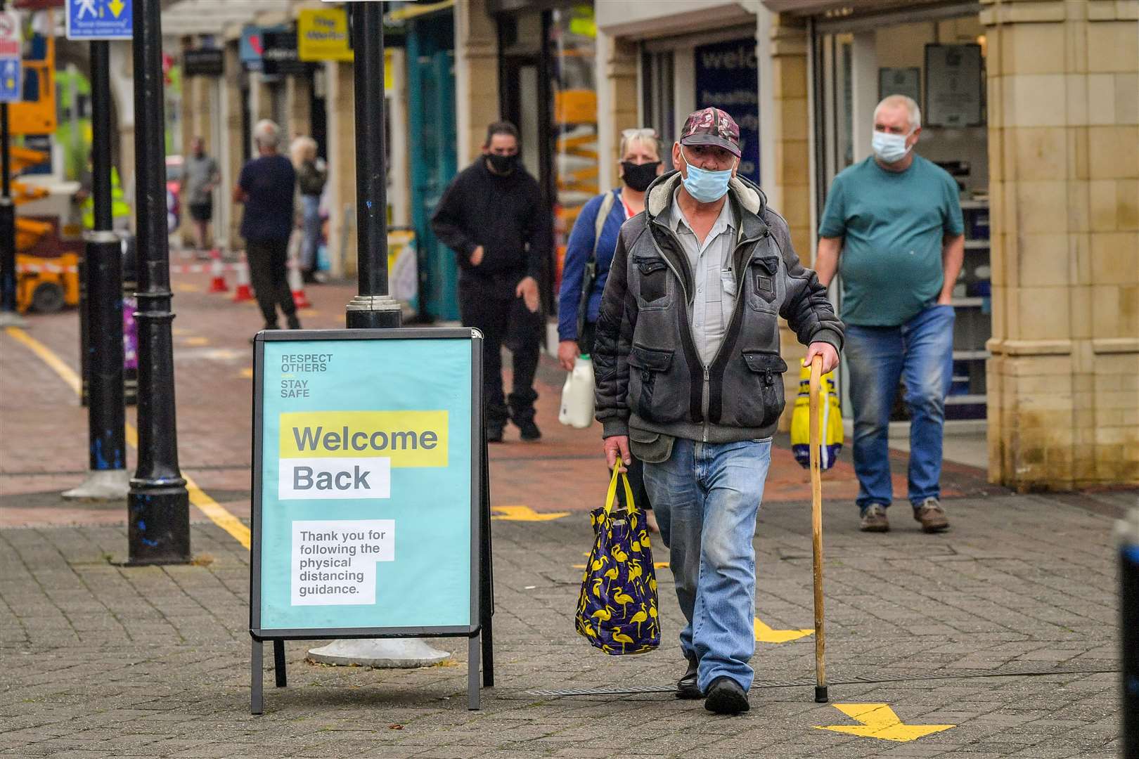 Shoppers walk around the stores in Caerphilly (Ben Birchall/PA)