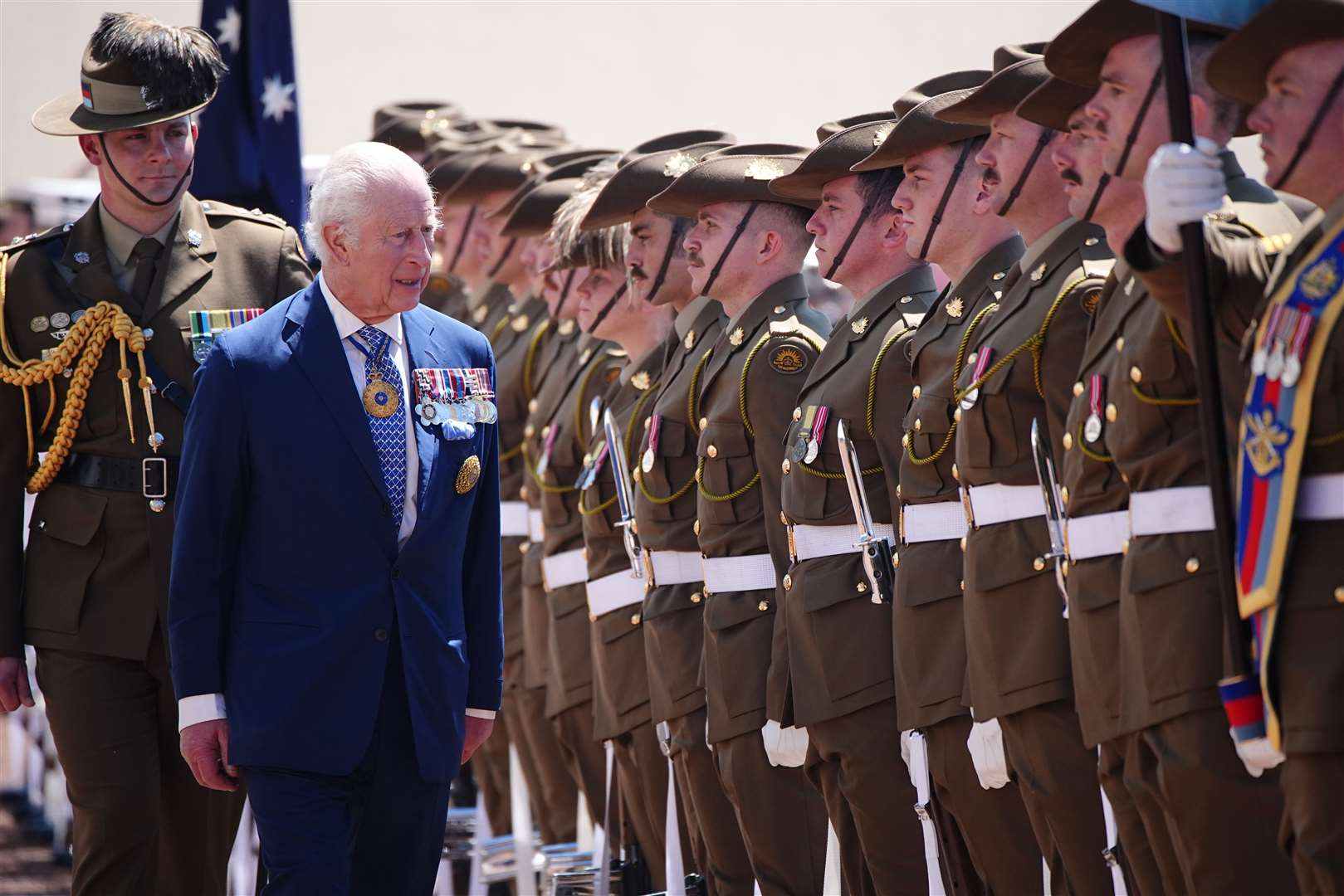 The King views the royal guard of honour during the ceremonial welcome at Australian Parliament House in Canberra (Aaron Chown/PA)