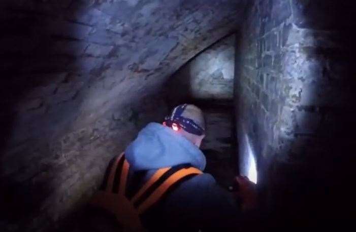 People exploring the abandoned flooded tunnels at Shornemead Fort. Picture: ASHMAN TV/YouTube