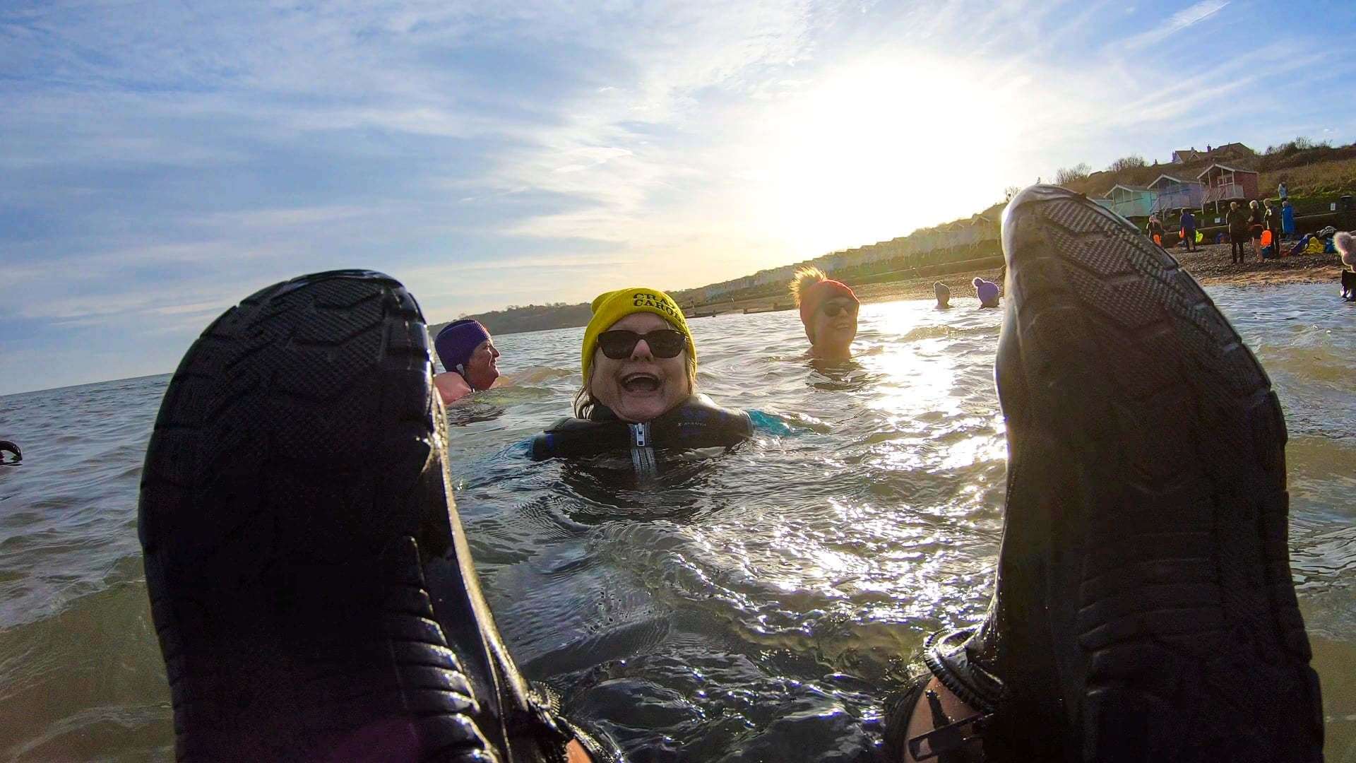 Feet up: The Sheppey Bluetits 'wild' swimming club made a splash on new year's day by taking the plunge in the sea at The Leas, Minster. Picture: James Mead