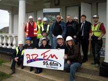 Some of the BRFM team with workers from Carillion outside the station's new base in Sheerness