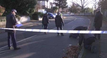 Police officers searching for clues at the scene. Picture: RICHARD EATON