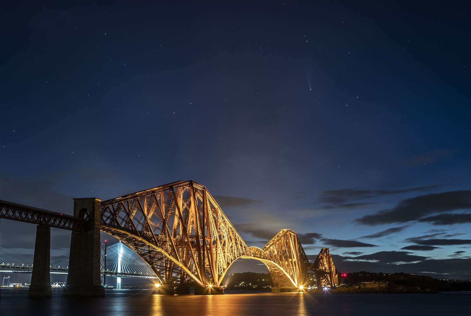 Comet Neowise in the skies above the Forth Bridge, South Queensferry (Jane Barlow/PA)