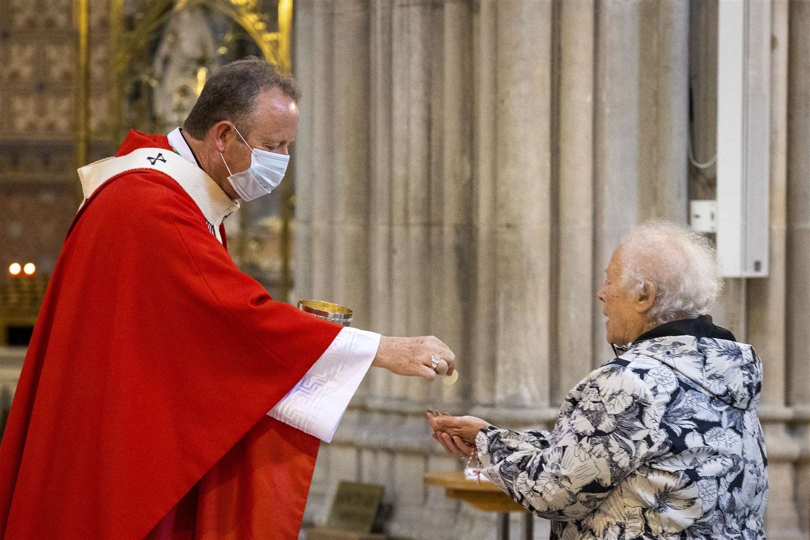 Archbishop Eamon Martin, the leader of the Catholic church in Ireland, gives holy communion to a parishioner during mass at St Patrick’s Catholic Cathedral in Armagh (Liam McBurney/PA)