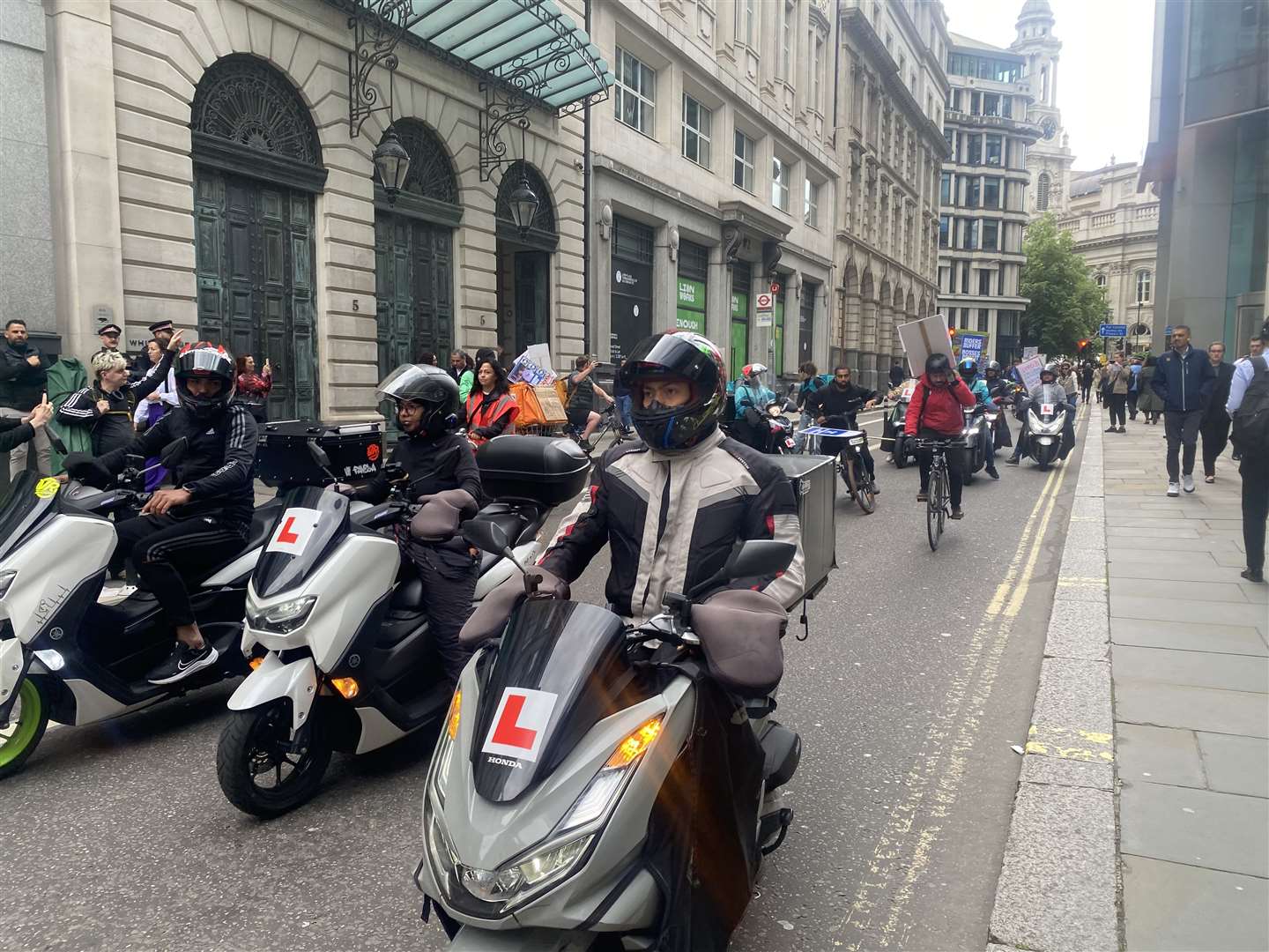 Deliveroo drivers stage a motorcade protest after the company’s AGM (Rebecca Speare-Cole/PA)