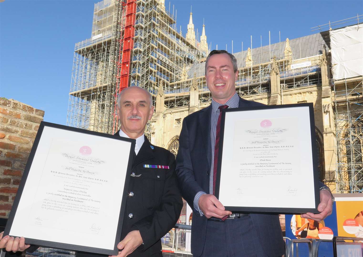 Head of cathedral security Jim Morley, left, and Cathedral Journey project manager Mark Hosea with their Royal Humaine Society testimonials