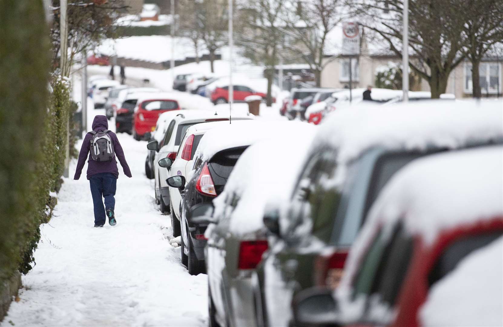 A woman walks through the snow in Penicuik, Midlothian (Jane Barlow/PA)