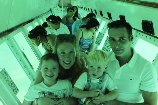 Rachel Thomas and husband Luke Thomas with sons Hugo and Pierce on a glass-bottom boat on their holidays