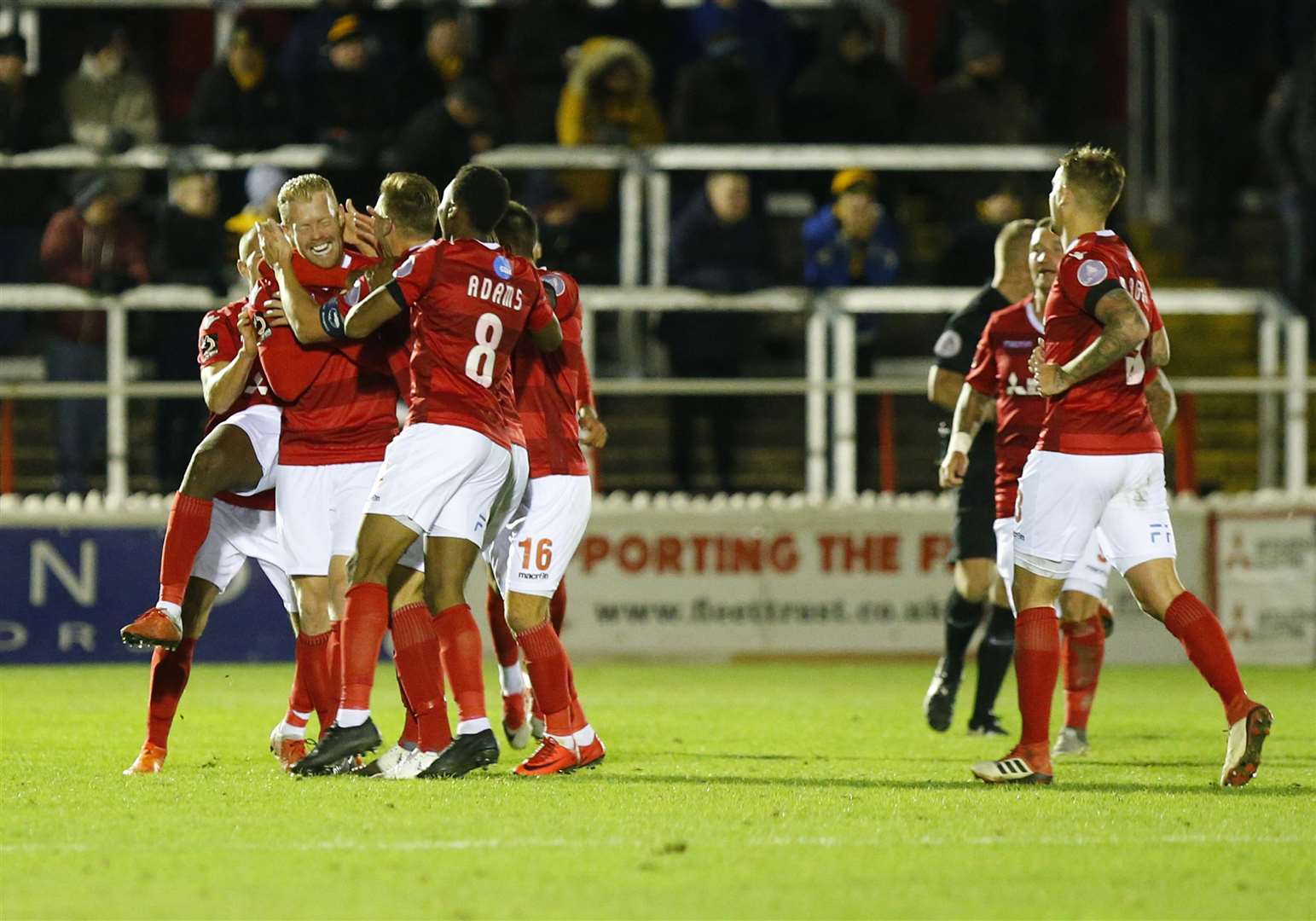 Kenny Clark is mobbed after breaking the deadlock Picture: Andy Jones