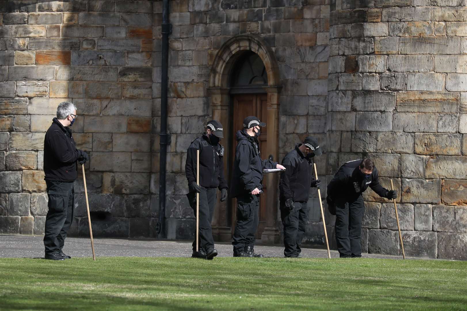 Police officers were seen conducting a search within the grounds of the Palace of Holyroodhouse (Andrew Milligan/PA)