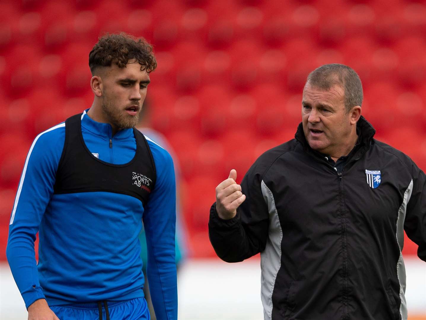 Gillingham coach Mark Patterson talks with Gillingham's Bradley Stevenson before his first league start Picture: Ady Kerry