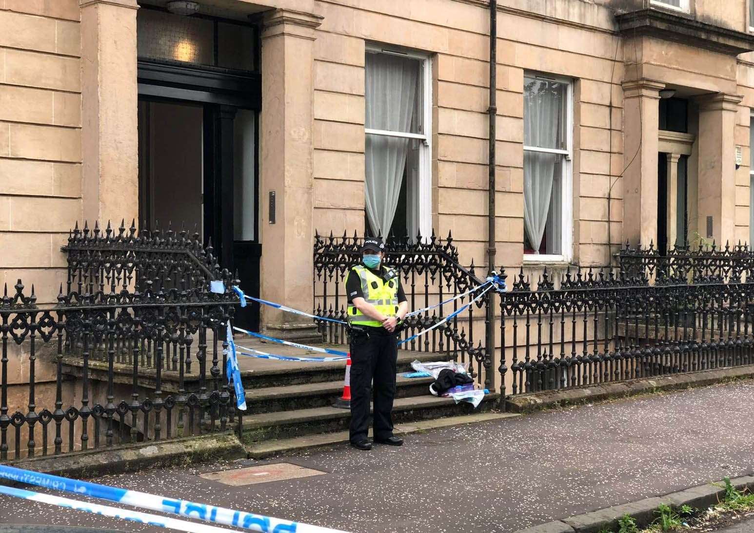 Police stood guard outside Esther Brown’s home after her body was found (Douglas Barrie/PA)