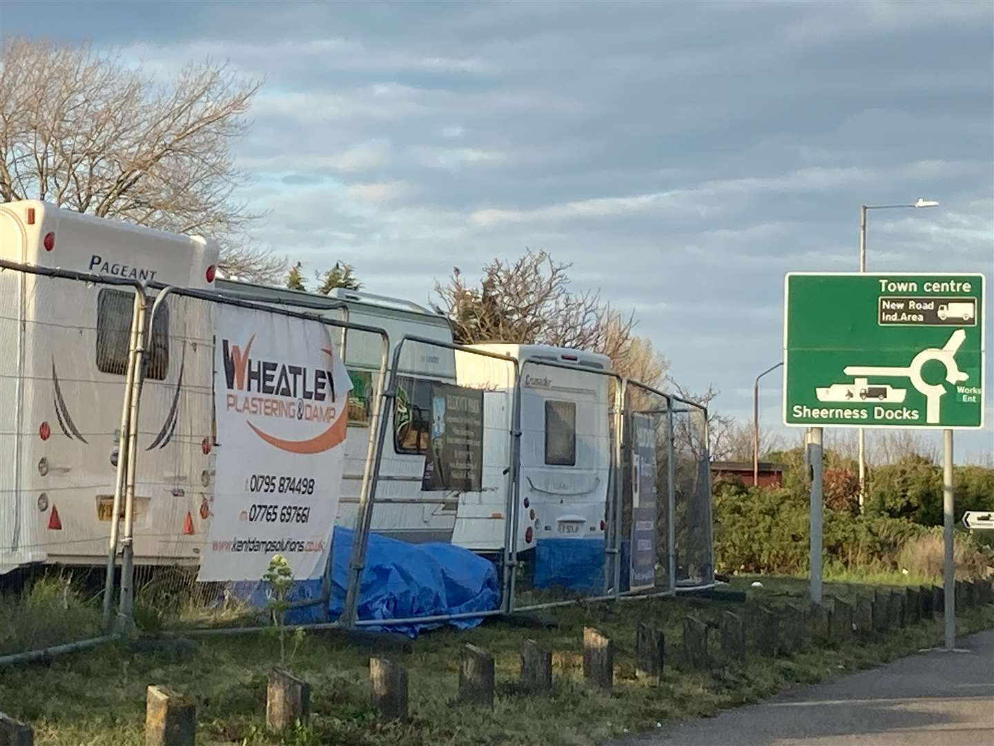 Travellers are camping at the entrance of Blue Town near historic Naval Terrace