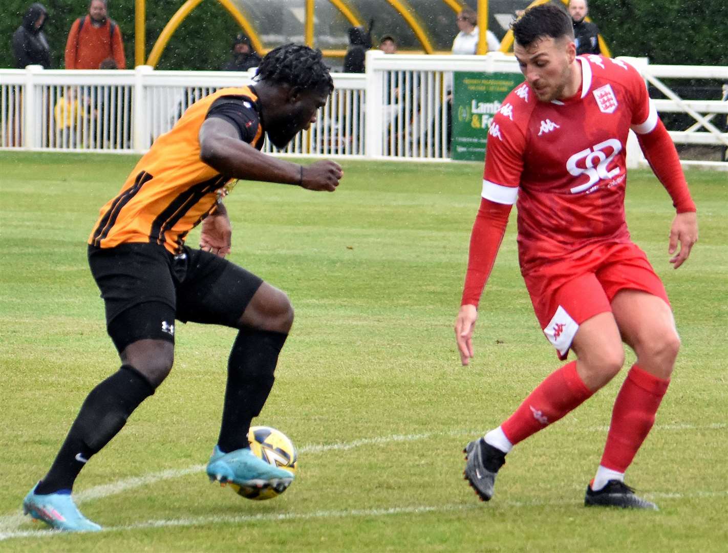 Folkestone striker David Smith attempts to cut inside Faversham defender Jake McIntyre during Invicta’s weekend 6-1 friendly win at Cheriton Road. Picture: Randolph File