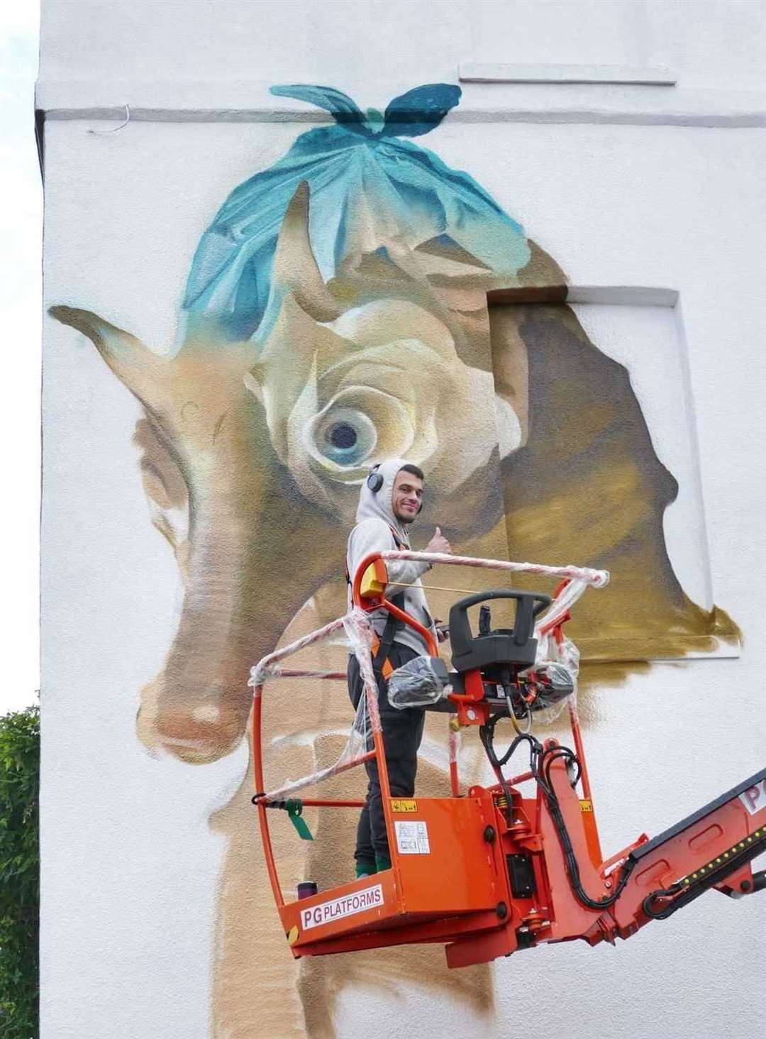 Artist Curtis Hylton working on his Oxford Street mural, which depicts four seahorses in a reference to the four horsemen of the apocalypse. Picture: Frank Leppard