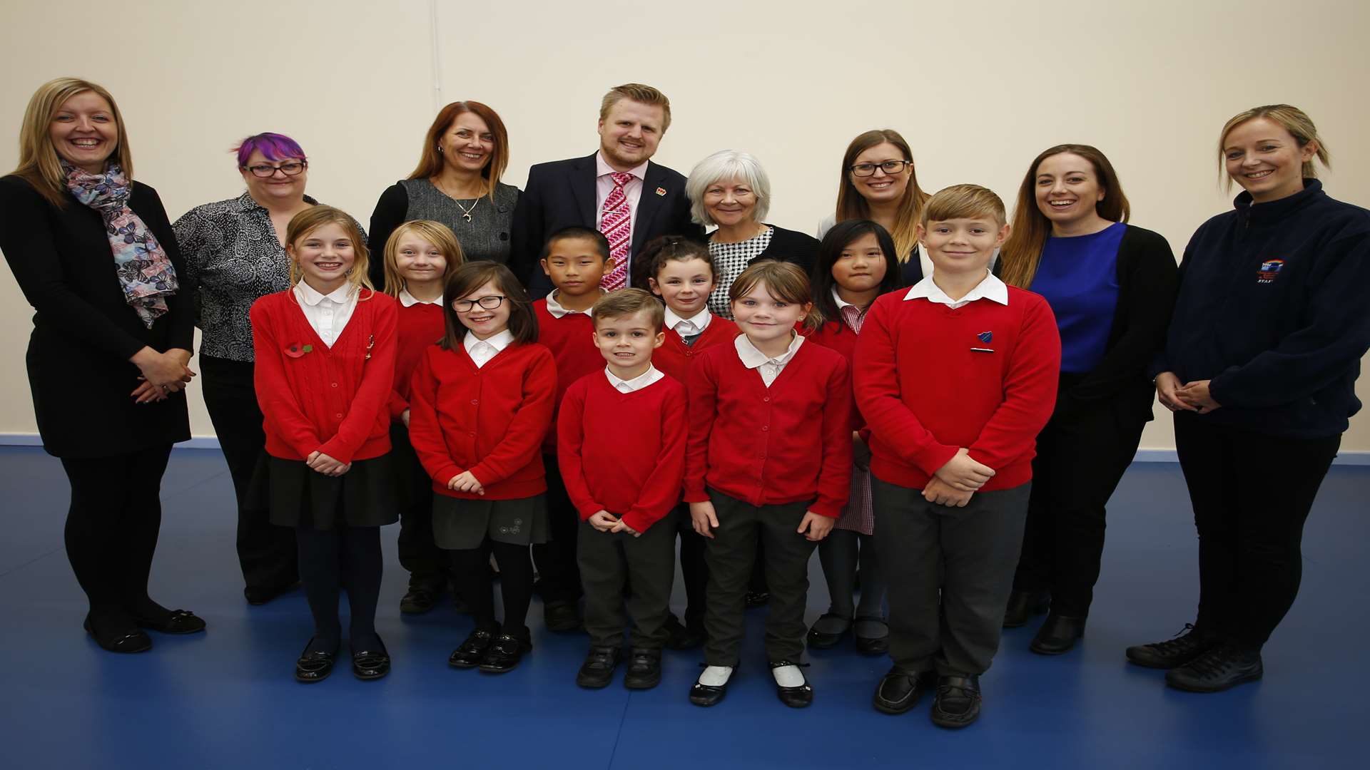 Deputy head Jason Howard and head teacher Barbara Conroy with key staff and pupils