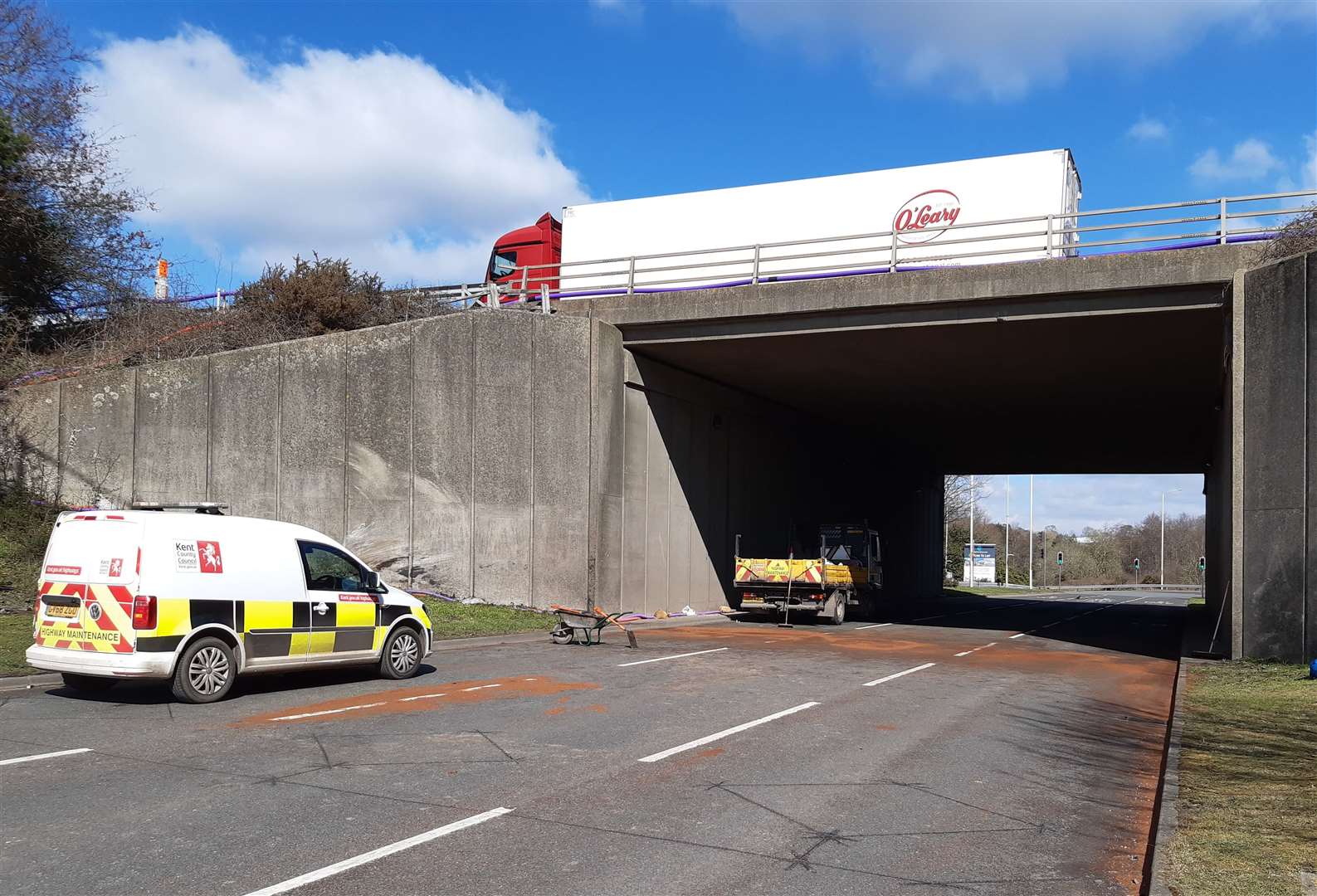 Contractors pictured clearing the scene after the crash in March