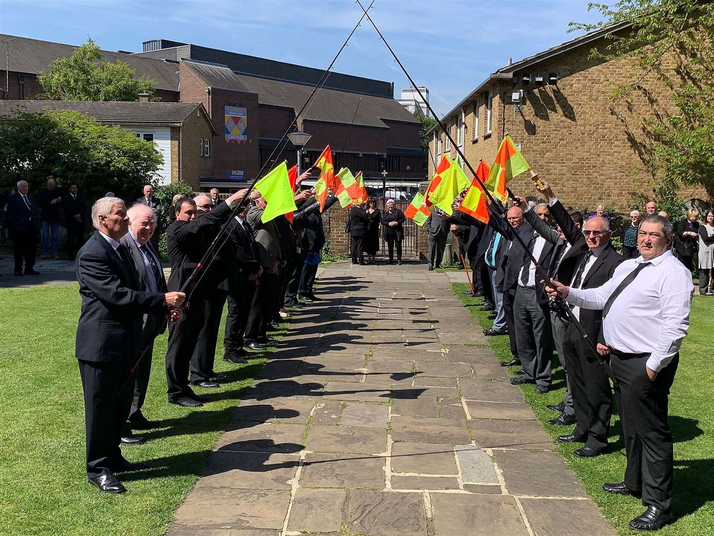 Referees and fishermen held a guard of honour for the funeral of Graham East (10522021)