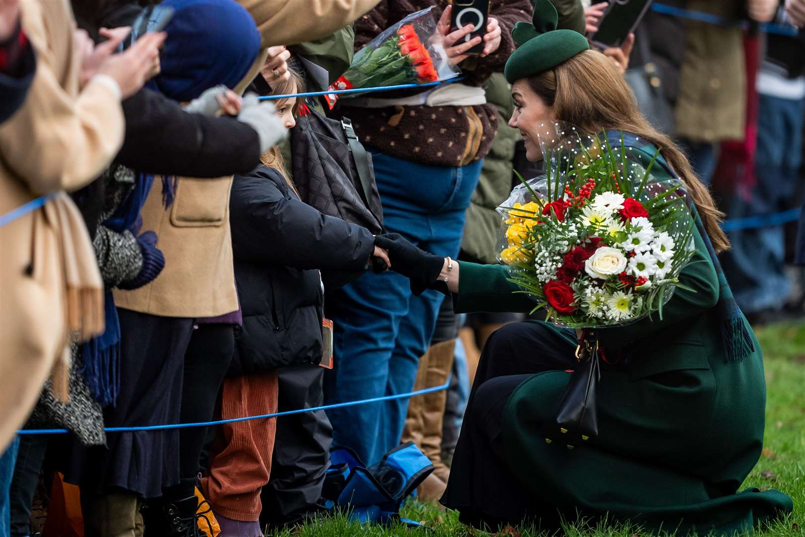 Kate speaks to a young well-wisher at Sandringham (Aaron Chown/PA)