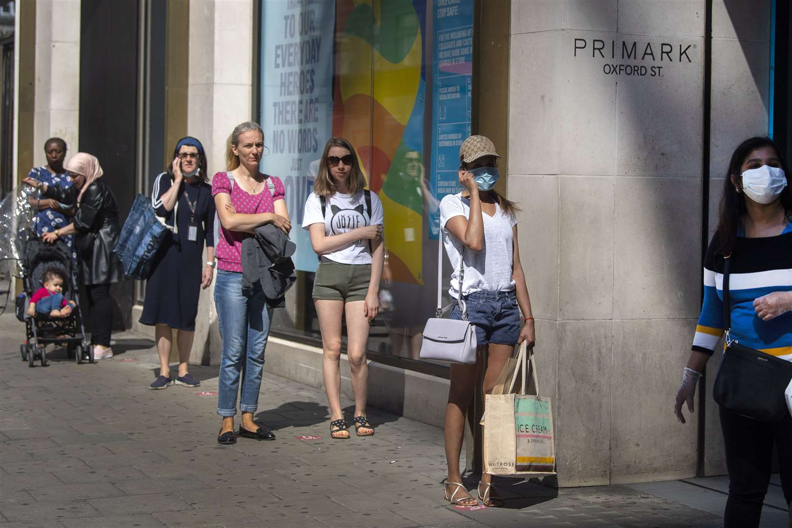 Queues formed as shops reopened in England on Monday (Victoria Jones/PA)