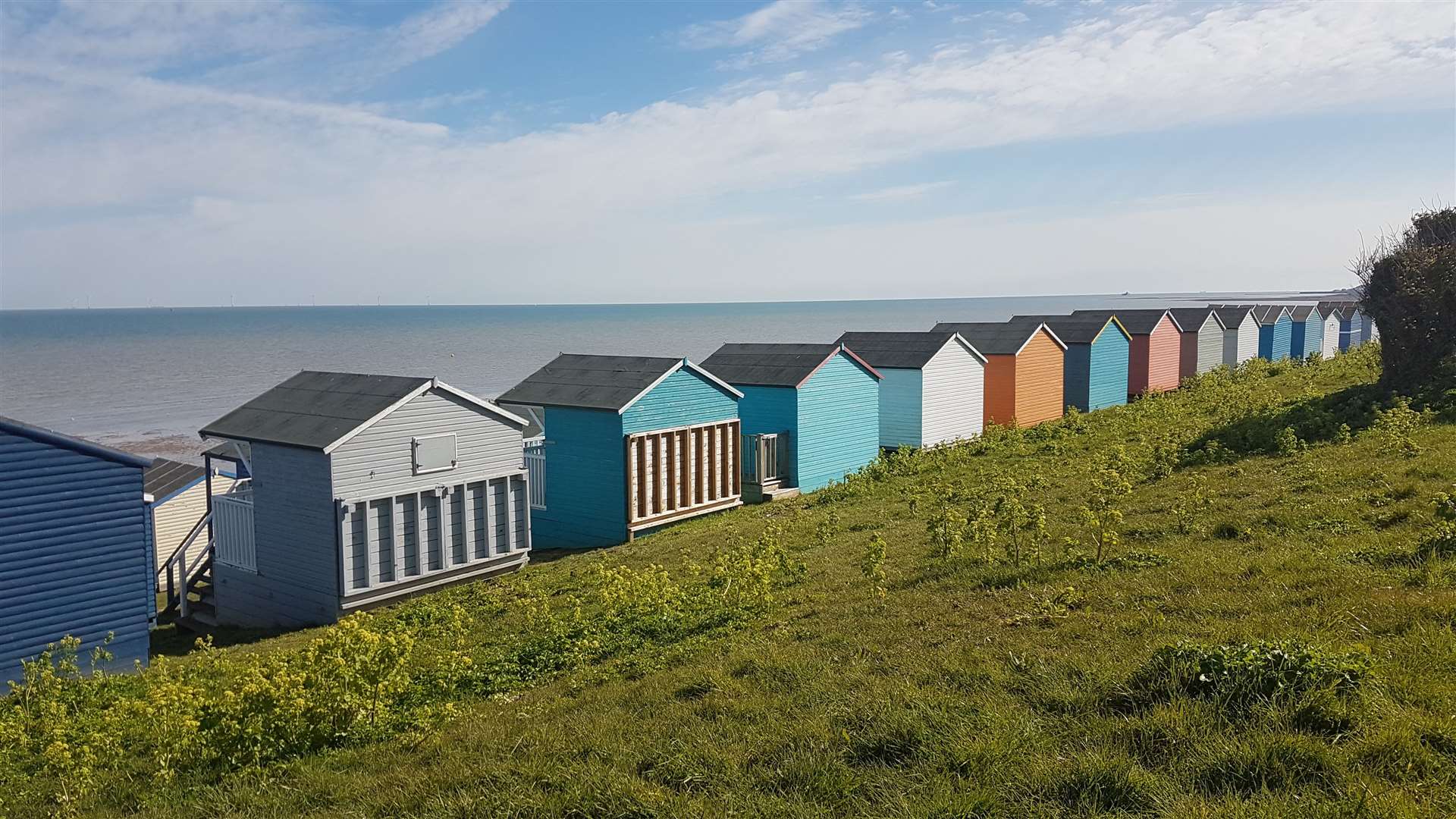 Beach huts overlooking the sea on Tankerton Slopes