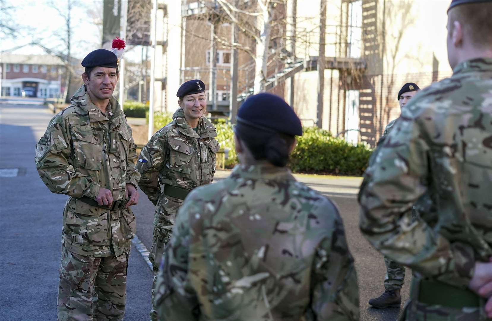 Lt Col Shamus Kelly and his wife Lt Col Lyndsey Kelly talk to soldiers (Steve Parsons/PA)