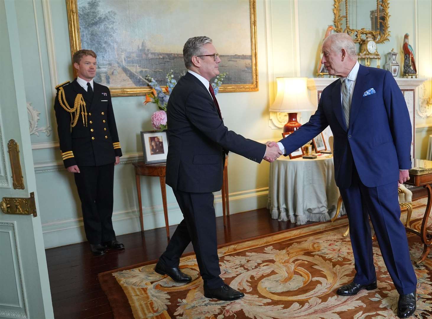 King Charles III welcomes Sir Keir Starmer during an audience at Buckingham Palace