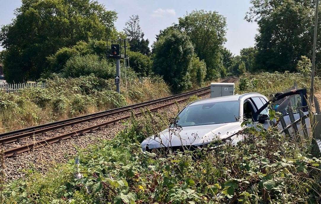 A Volvo has crashed into a metal railway fence off Brielle Way, Sheerness. Picture: Network Rail