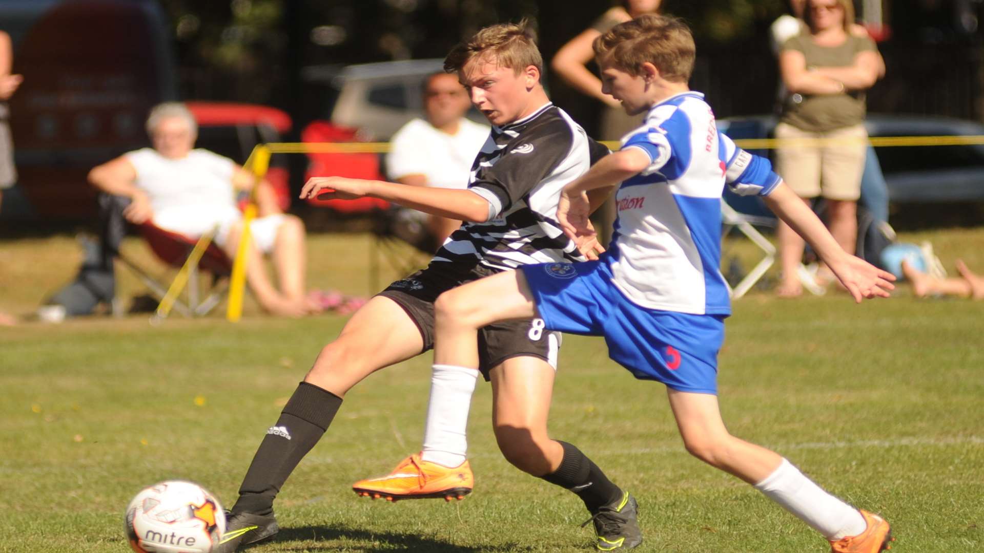 Under-13s from Bredhurst Juniors and Milton & Fulston United contest possession in Division 1 Picture: Steve Crispe