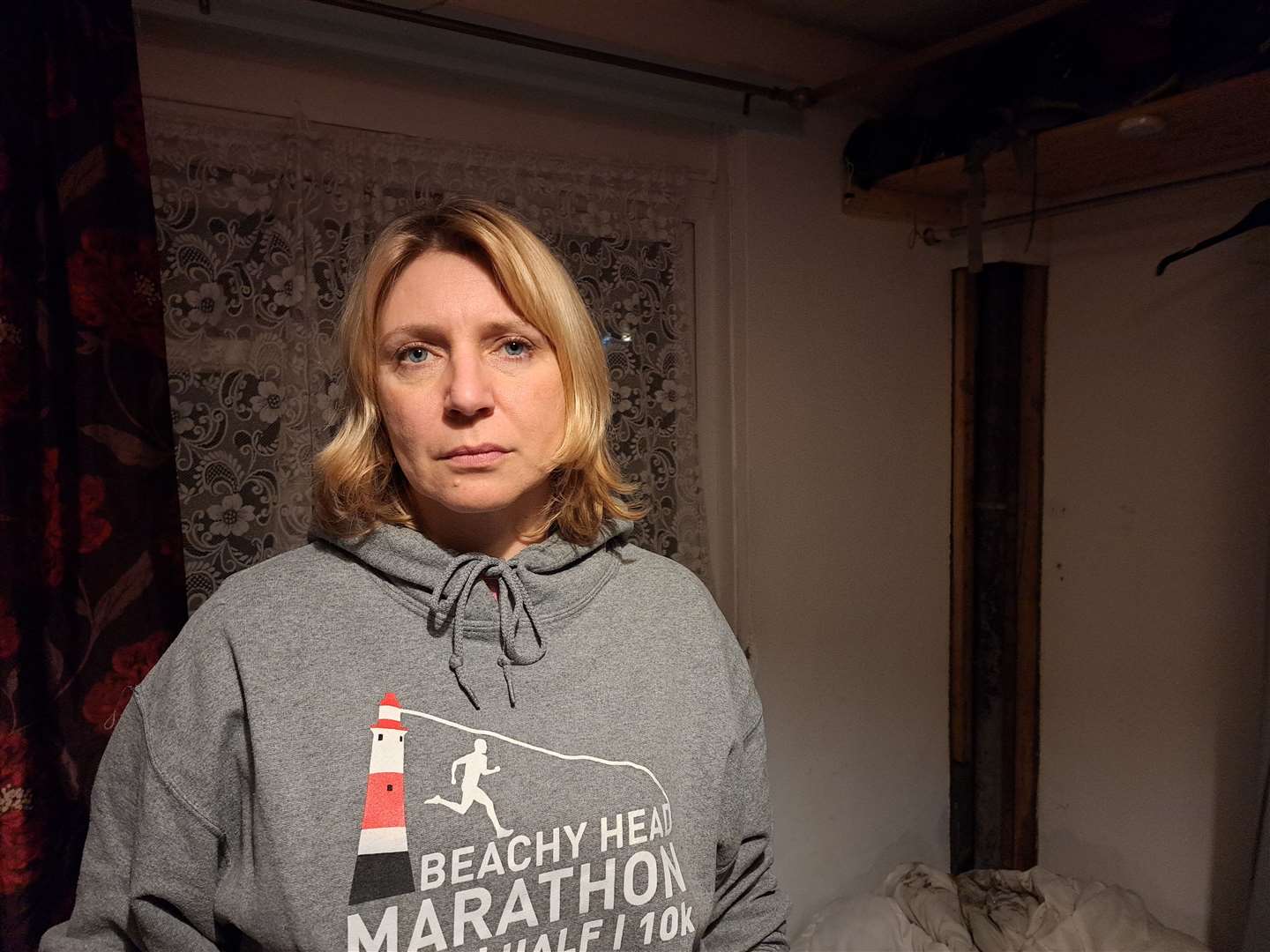 Canterbury resident Lidia Hill inside her bedroom - which was flooded with water last week