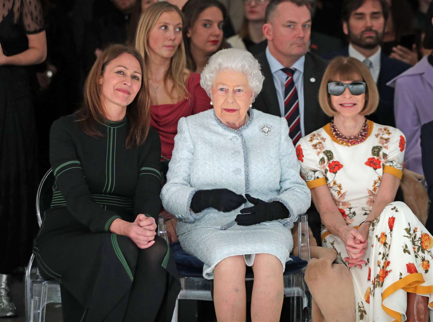 The Queen wearing the Cullinan V brooch in the front row of a catwalk show at London Fashion week with Anna Wintour (Yui Mok/PA)