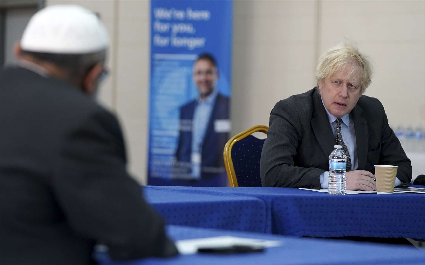 Speaking to members of staff during a visit to a coronavirus vaccination centre in Batley, West Yorkshire (Jon Super/PA)