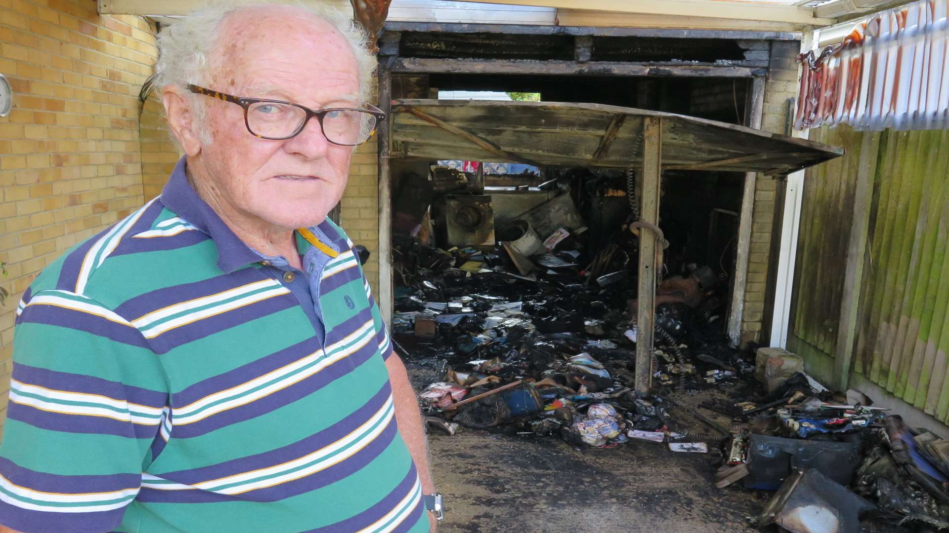 Colin Goldsack outside his badly-damaged garage