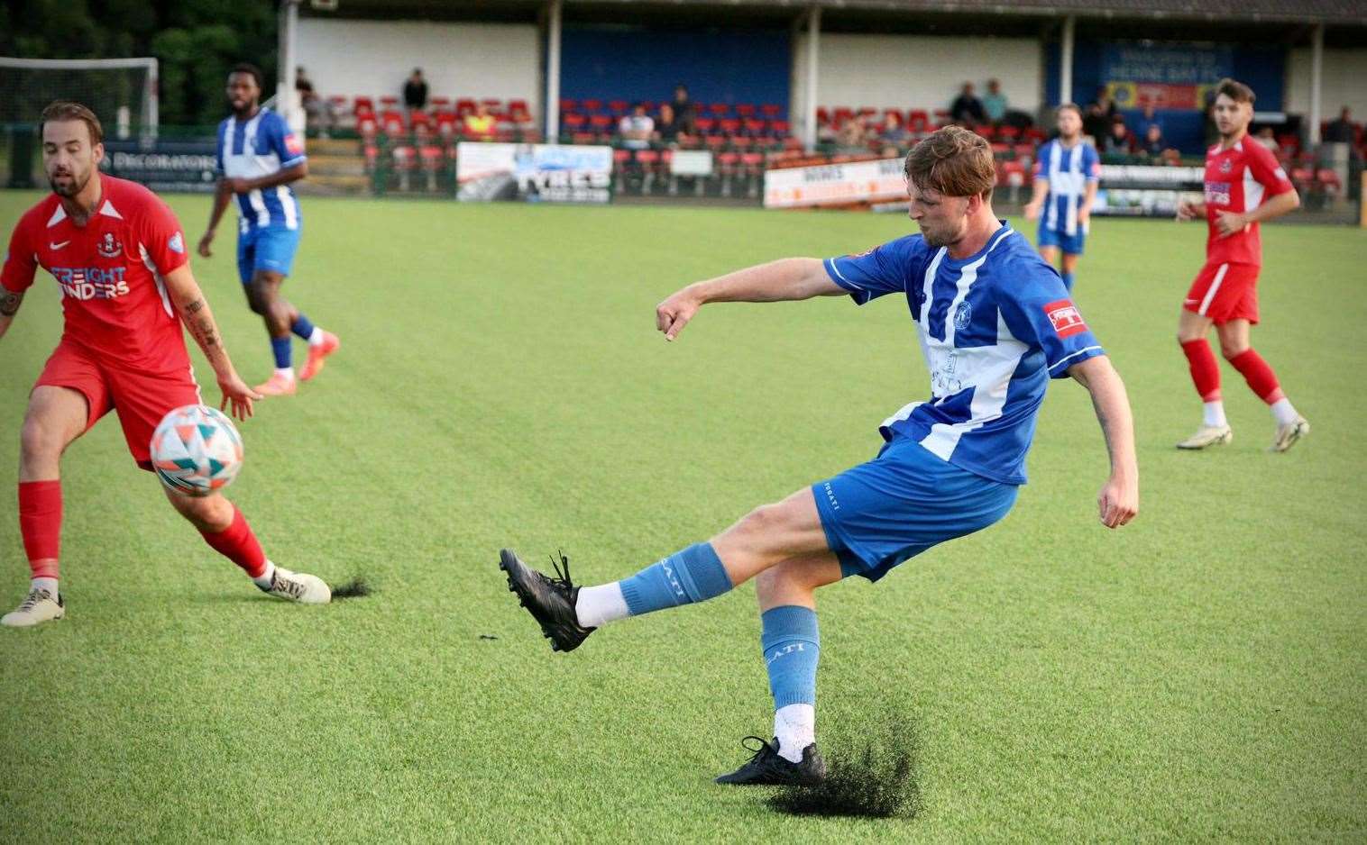 Tom Hanfrey sends the ball forward for Herne Bay. Picture: James Aylward