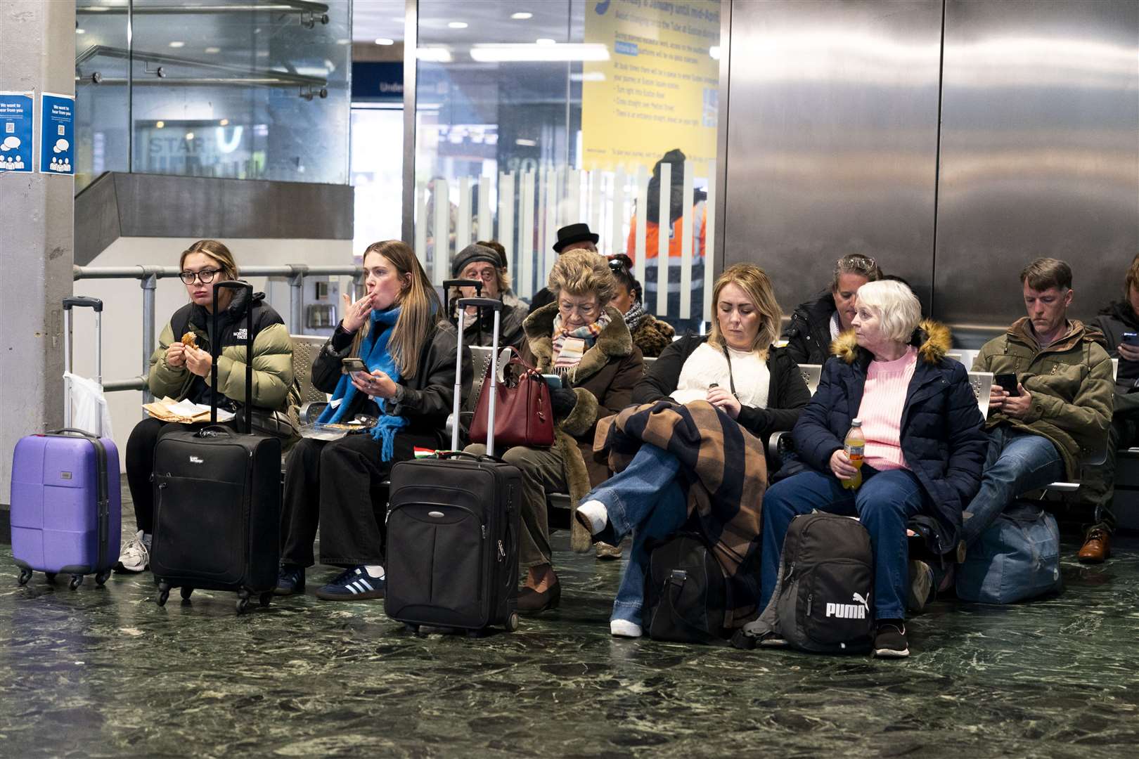 Passengers at London’s Euston station on Sunday following train delays as Storm Isha brought severe disruption to rail services (Jordan Pettit/PA)