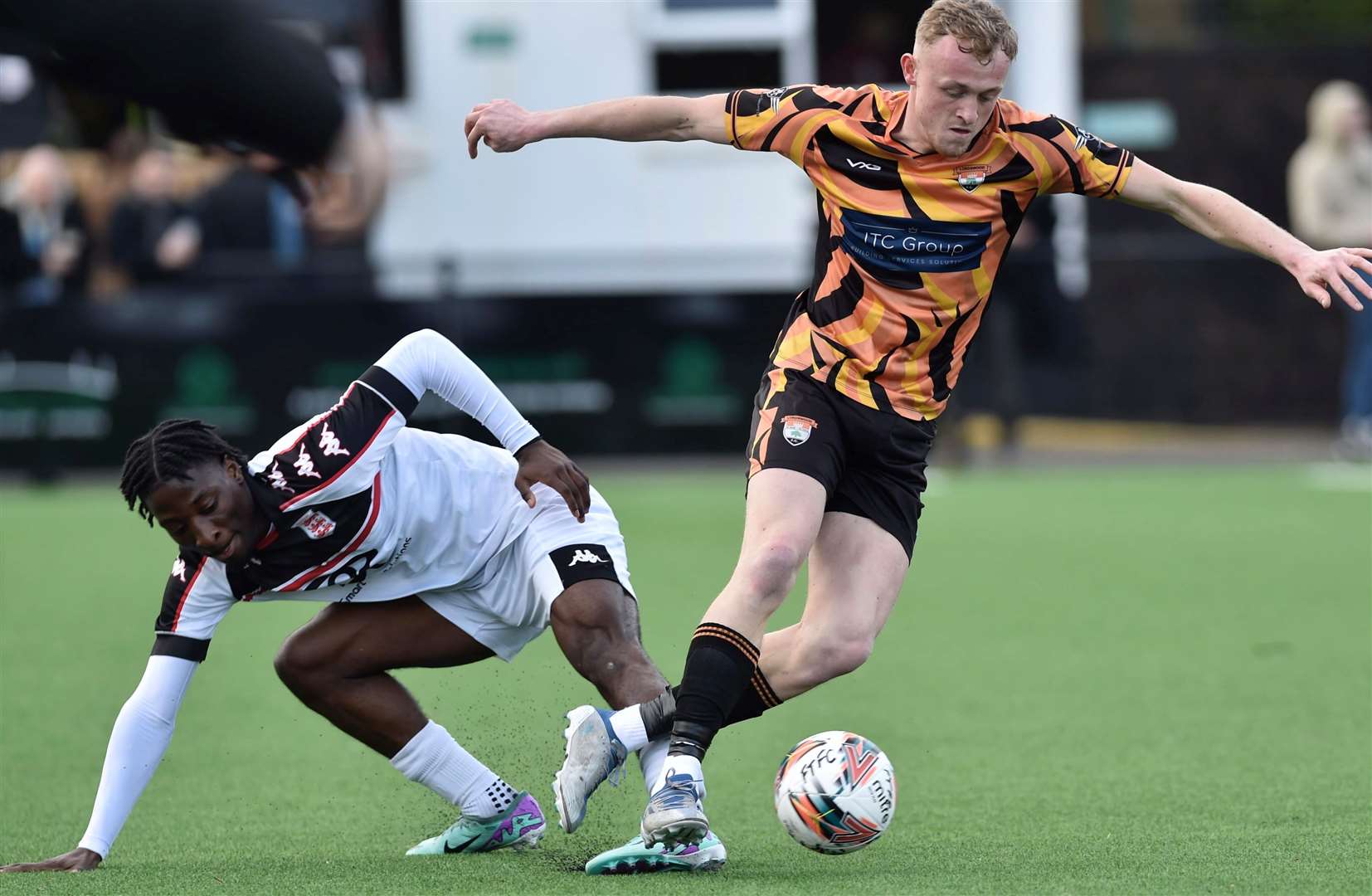 Callum Peck on the ball in Lordswood’s 3-2 win at Faversham on Saturday, as he gets past Faversham defender Rahman Kareem. Picture: Ian Scammell