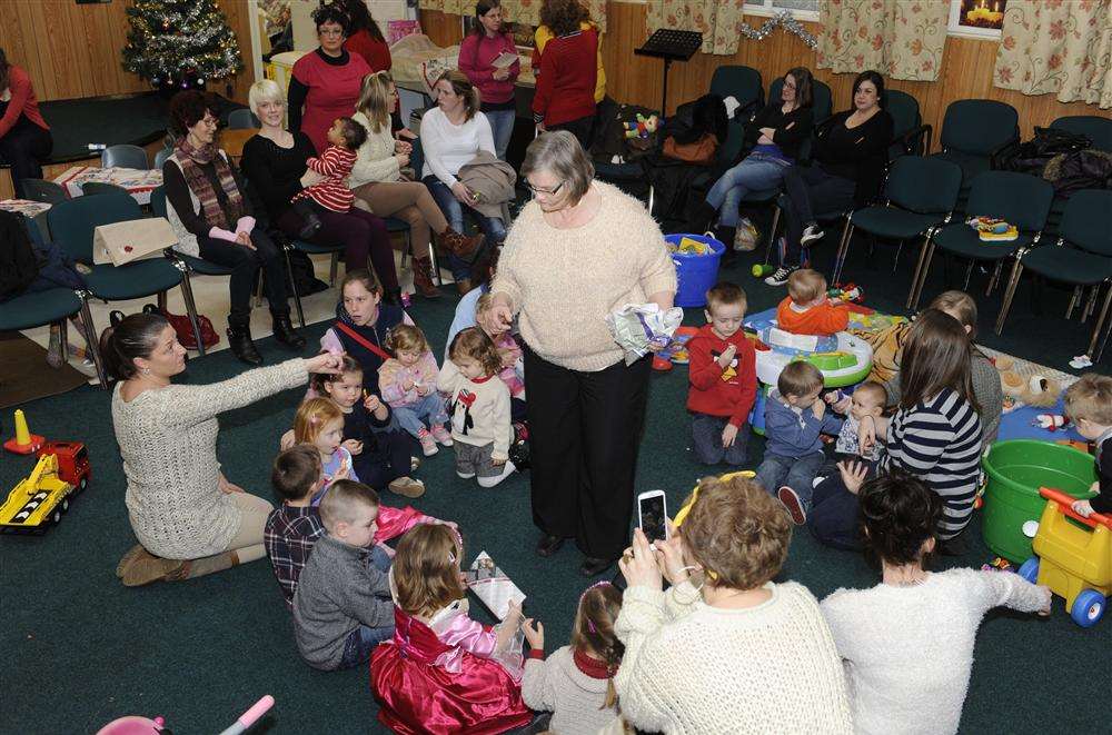 Christine Belsey with the Precious Jewels parent and toddler group she started 28 years ago as Marion Montgomery (centre) organises the party games